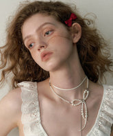 Collar con colgante doble de borla y cadena de lazo de perla de aleación blanca de moda